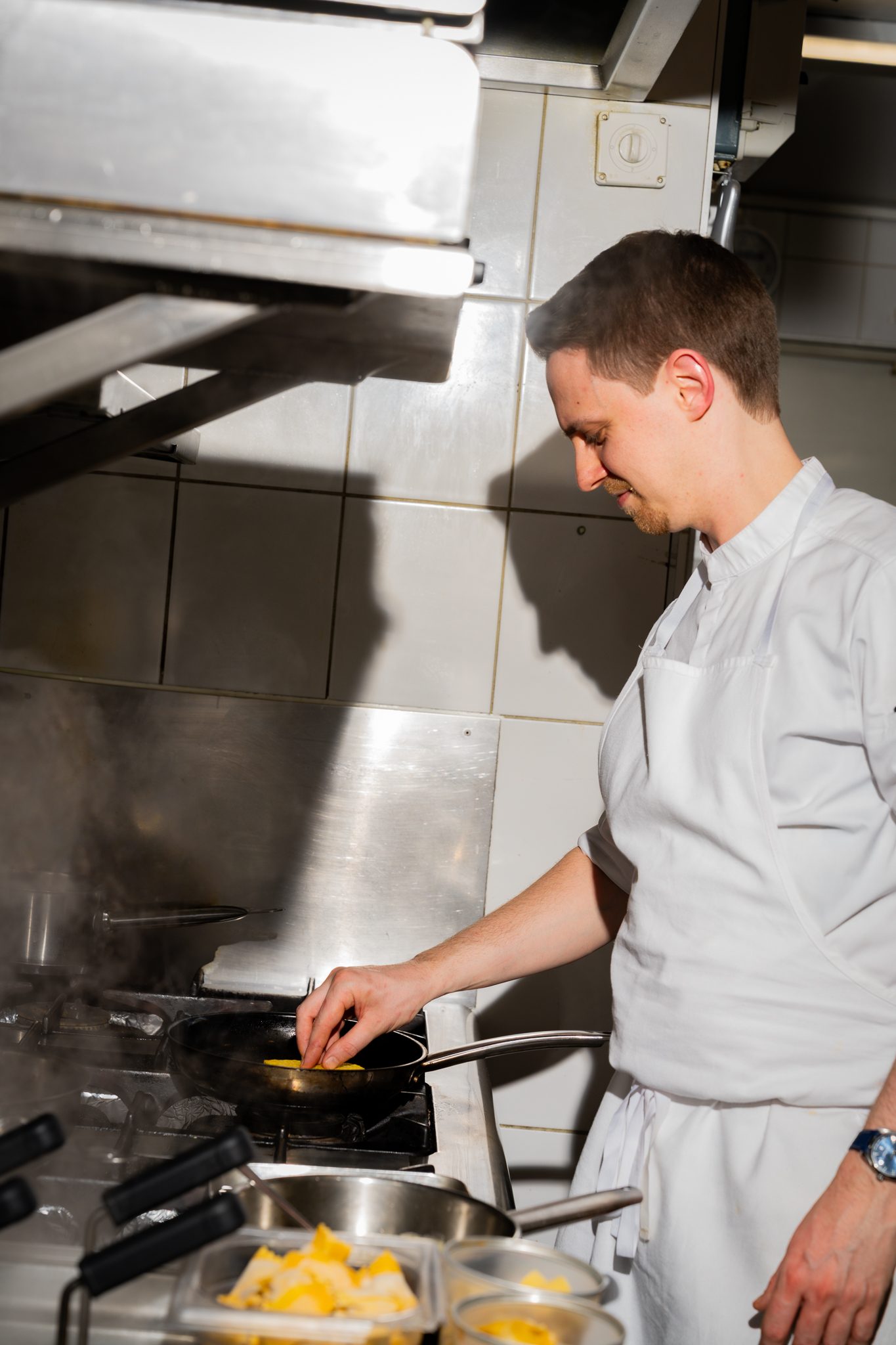 A cook at the stove