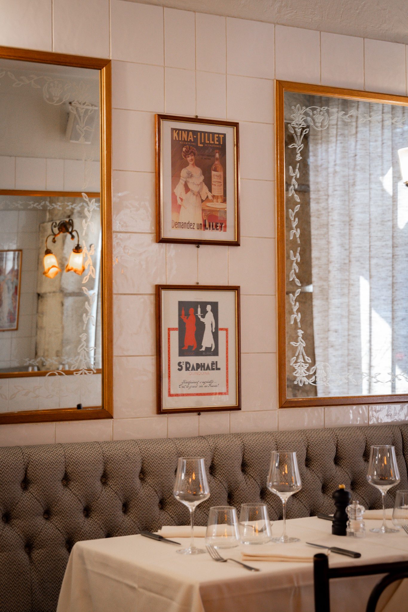 The buttoned banquette and vintage posters